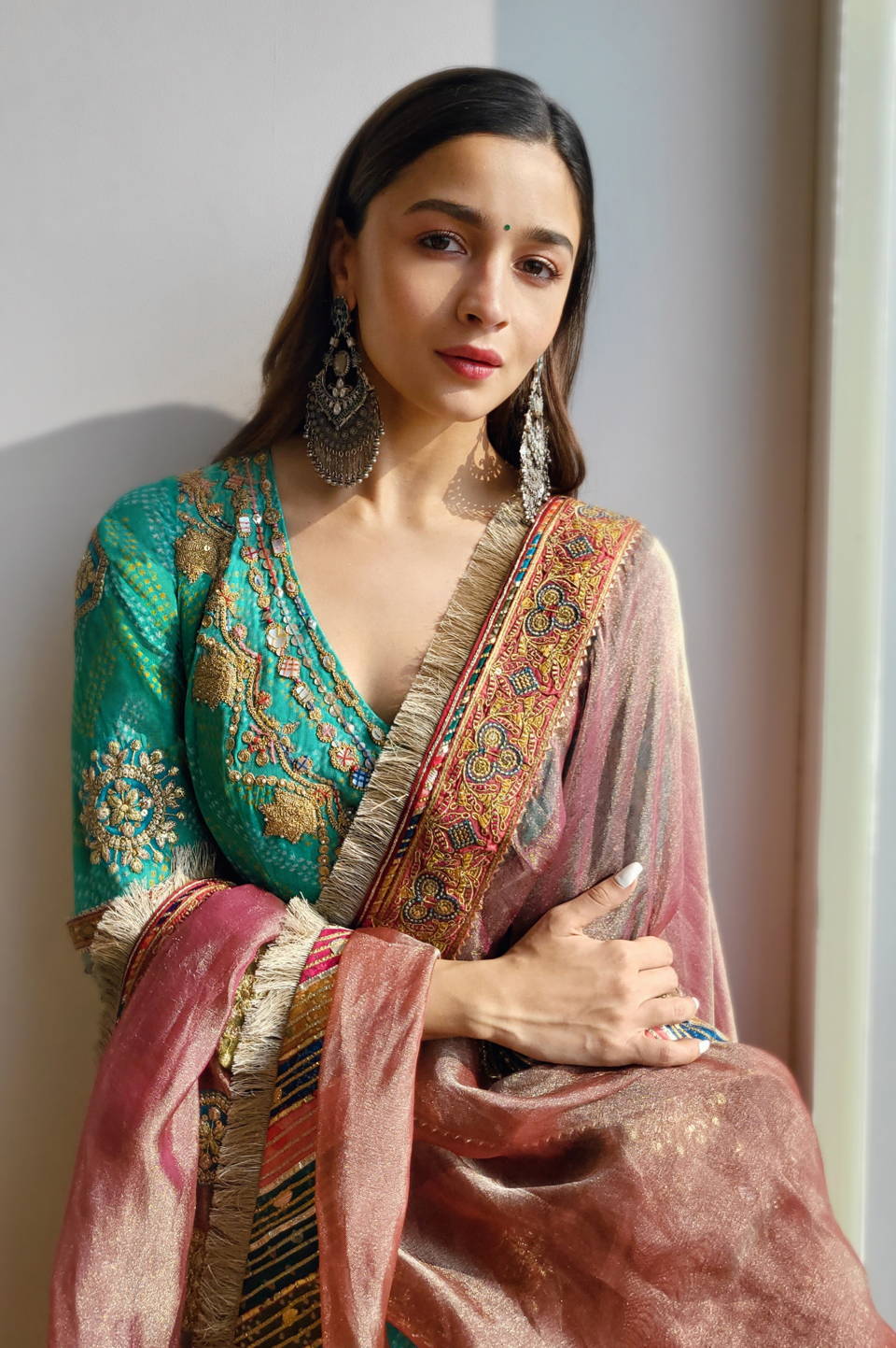 Alia Bhatt looks resplendent in the turquoise green outfit by Couturiers Rimple and Harpreet Narula
