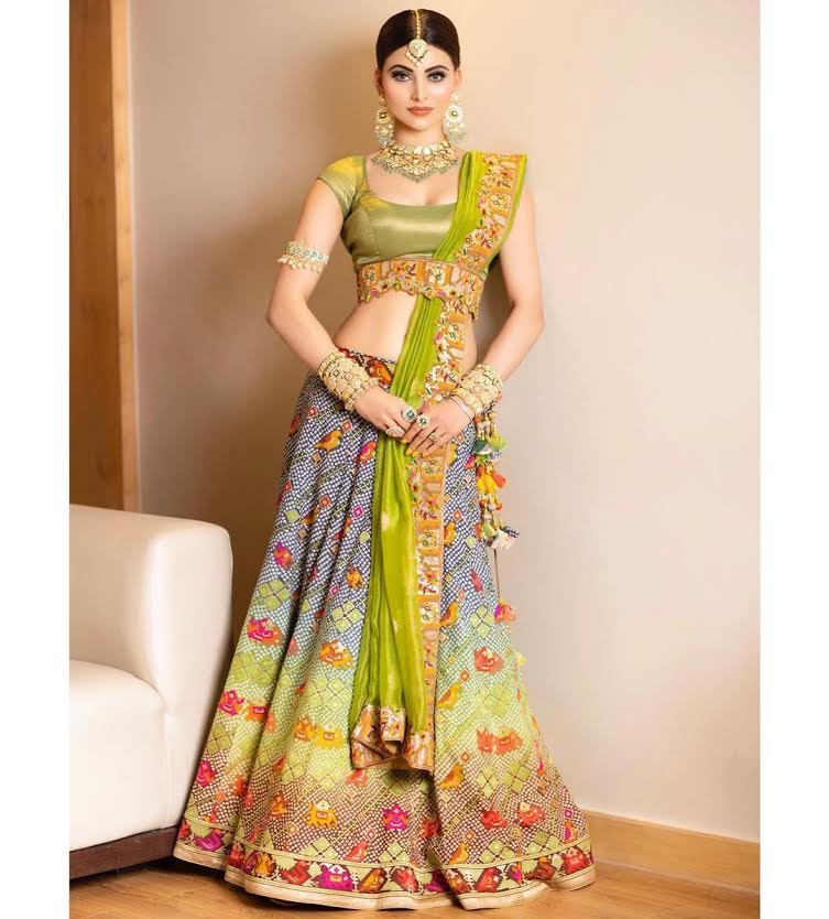 Urvashi Rautela giving traditional vibes in bandhani lehenga and statement jewellery for a recent wedding!
