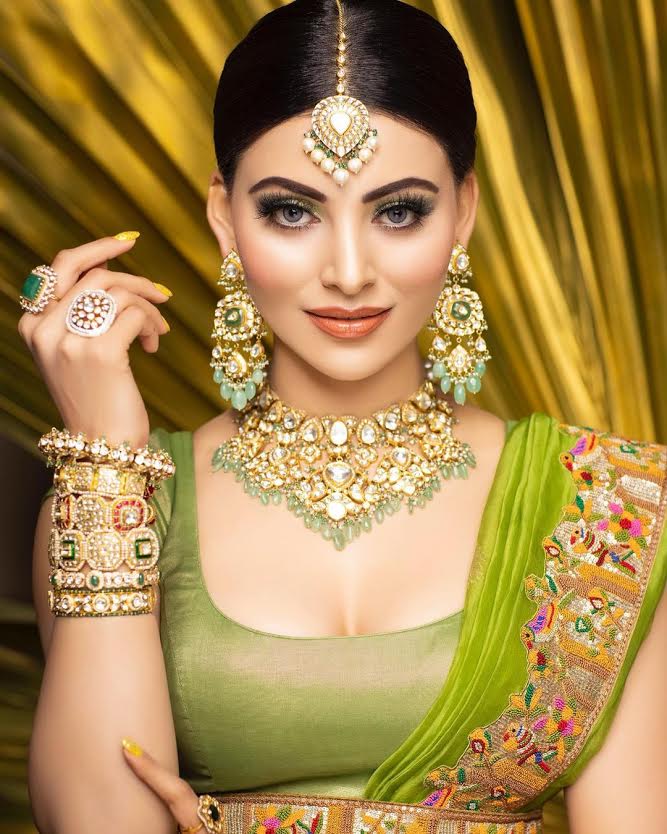 Urvashi Rautela giving traditional vibes in bandhani lehenga and statement jewellery for a recent wedding!
