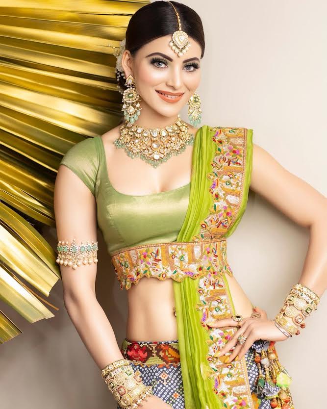 Urvashi Rautela giving traditional vibes in bandhani lehenga and statement jewellery for a recent wedding!